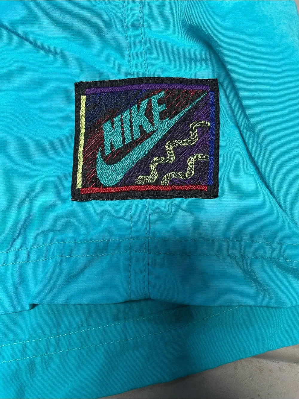 Nike Men's Turquoise Vintage Swim Trunks with Black Waistband and Purple Accents